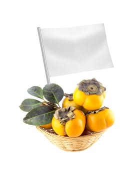 Healthy and organic food concept. Fresh persimmons with flag showing the benefits or the price of fruits.