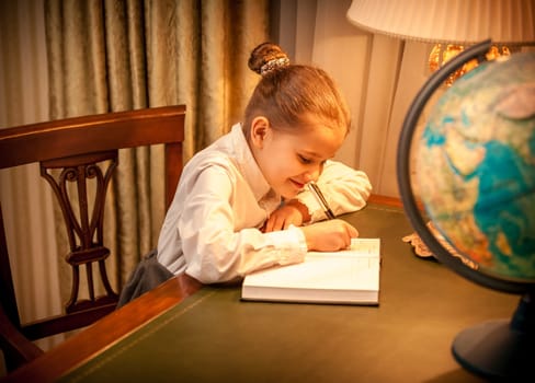 Black and white portrait of girl studying earth globe