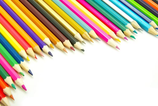 Assortment of coloured pencils  on white background