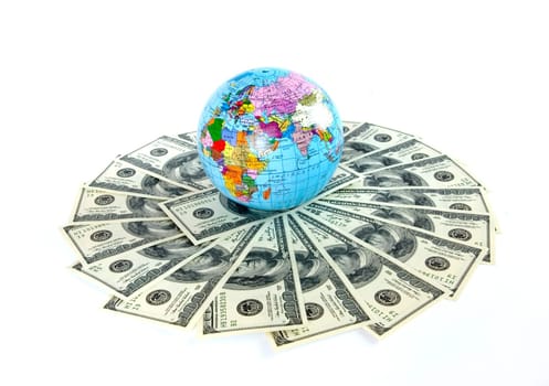 A globe and dollars is isolated on a whiteness