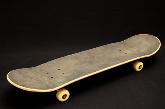 Vintage Style Black Skateboard on a black Background