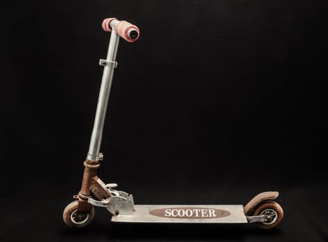 Metal scooter for child on white background