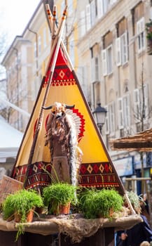View of native American statue next to the tepee