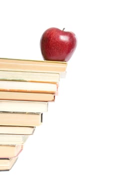 Red apple and stack of books for school