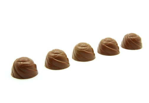 Delicious  chocolate pralines isolated on white