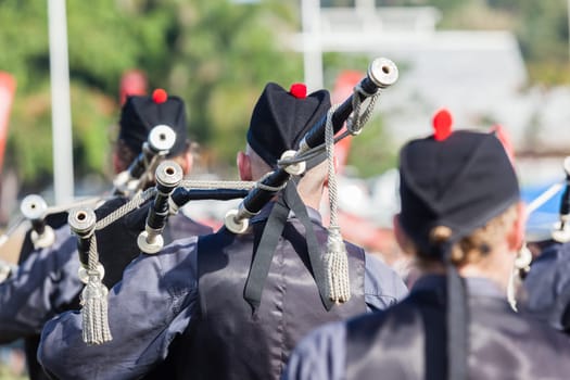 Scottish bands men and women play musical instruments in traditional Scottish clan colors dress at the Scottish Highland Gathering in Toti Durban South Africa