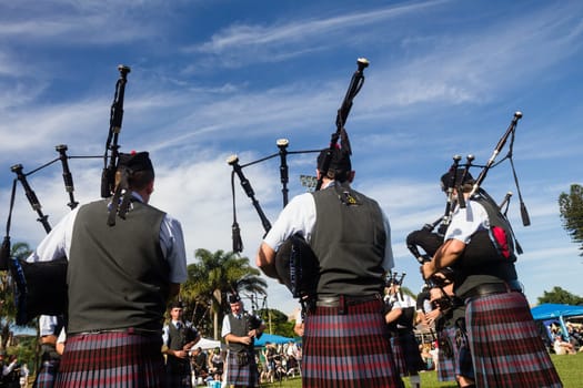 Scottish bands men and women play musical instruments in traditional Scottish clan colors dress at the Scottish Highland Gathering in Toti Durban South Africa