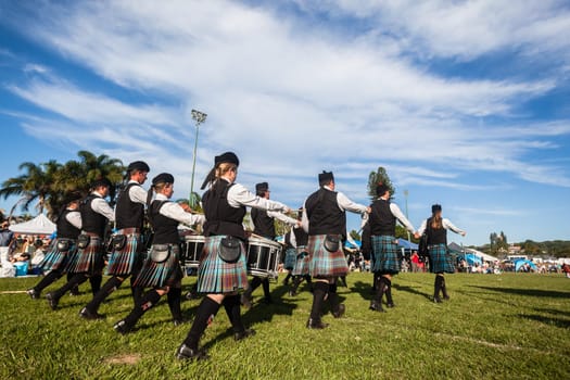 Scottish bands men and women play musical instruments in traditional Scottish clan colors dress at the Scottish Highland Gathering in Toti Durban South Africa
