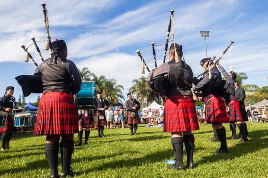 Scottish bands men and women play musical instruments in traditional Scottish clan colors dress at the Scottish Highland Gathering in Toti Durban South Africa