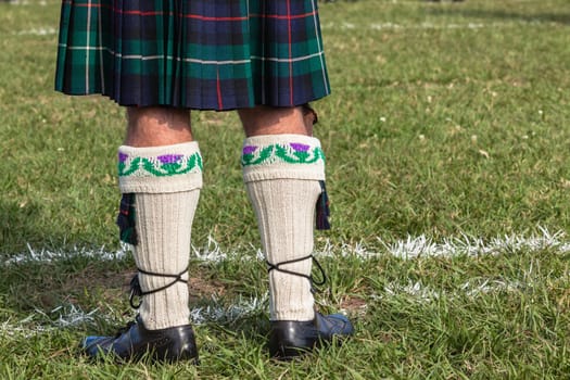 Scottish bands men and women play musical instruments in traditional Scottish clan colors dress at the Scottish Highland Gathering in Toti Durban South Africa