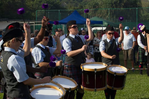 Scottish bands men and women play musical instruments in traditional Scottish clan colors dress at the Scottish Highland Gathering in Toti Durban South Africa