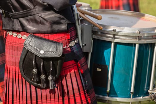 Scottish bands men and women play musical instruments in traditional Scottish clan colors dress at the Scottish Highland Gathering in Toti Durban South Africa