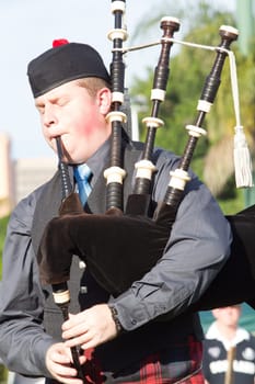 Scottish bands men and women play musical instruments in traditional Scottish clan colors dress at the Scottish Highland Gathering in Toti Durban South Africa