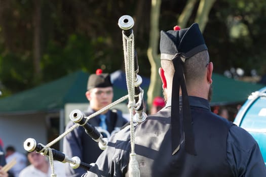 Scottish bands men and women play musical instruments in traditional Scottish clan colors dress at the Scottish Highland Gathering in Toti Durban South Africa