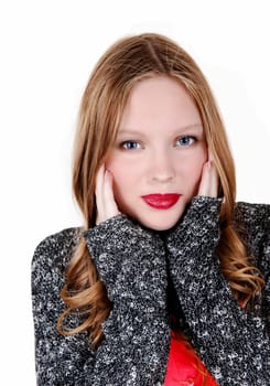 A young woman in a blue-grey sweater holding her hands on her face, .isolated for white background..