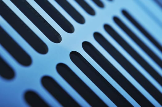 abstract industrial background made of aluminium ventilation grilles