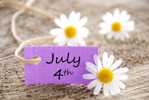 a purple label with white blossoms, copy space and background