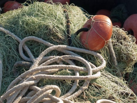 old fishing net with buoys in the port