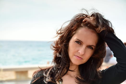 Cute woman walking on the beach