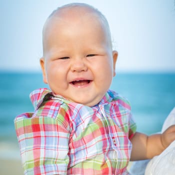 Cute baby on the tropical beach