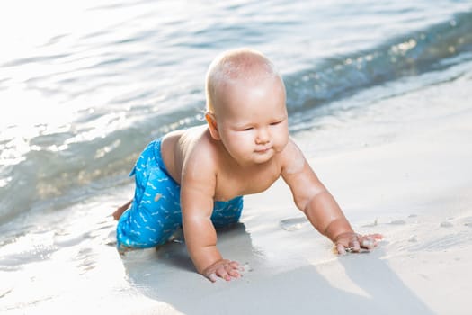 Cute baby on the tropical beach