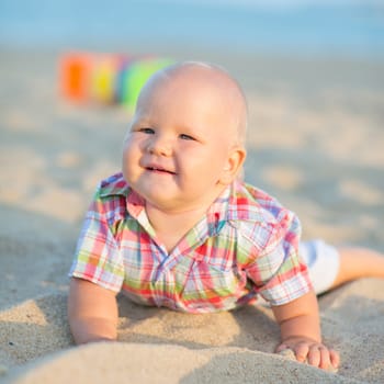 Cute baby on the tropical beach