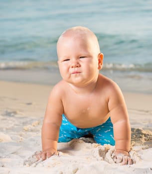 Cute baby on the tropical beach