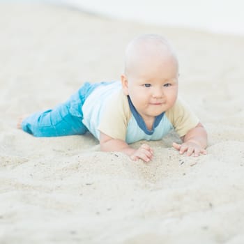 Cute baby on the tropical beach