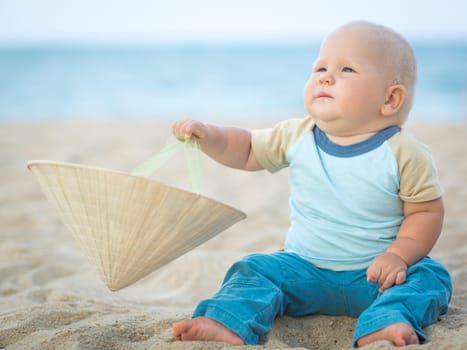 Cute baby on the tropical beach