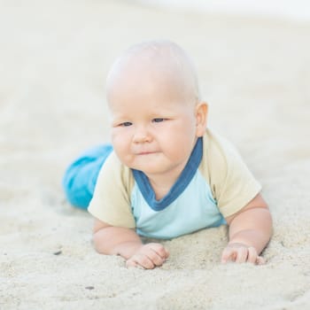 Cute baby on the tropical beach