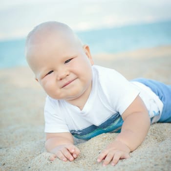 Cute baby on the tropical beach