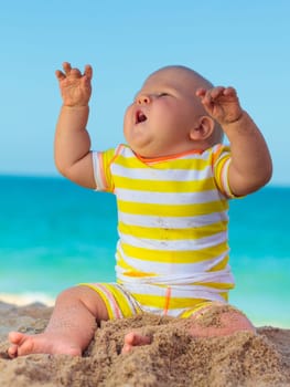 Cute baby on the tropical beach