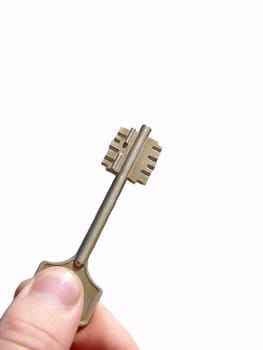 Hand holding the key of success