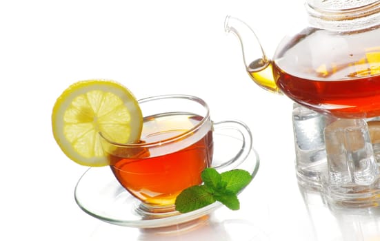 Tea being poured into glass tea cup