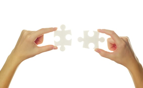 puzzle in hands isolated on white background