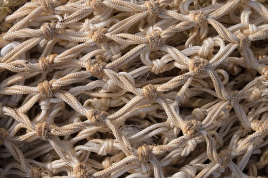 closeup of a fishing net on the quay of scheveningen harbor in the netherlands