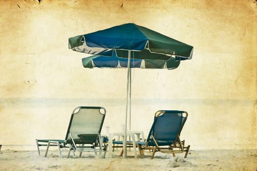 Vintage photo of chairs and umbrellas on the beach