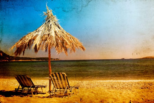 Vintage photo of chairs and umbrellas on the beach