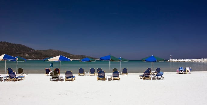 Vintage photo of chairs and umbrellas on the beach
