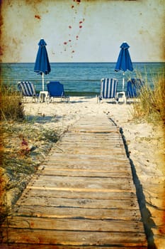 Vintage photo of chairs and umbrellas on the beach