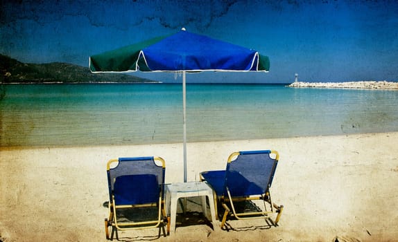 Vintage photo of chairs and umbrellas on the beach