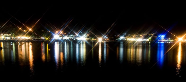 Night coastline, view of a village in Greece