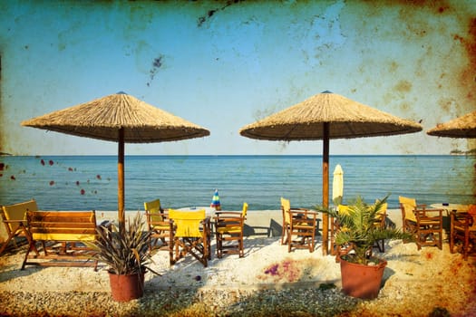 Vintage photo of chairs and umbrellas on the beach