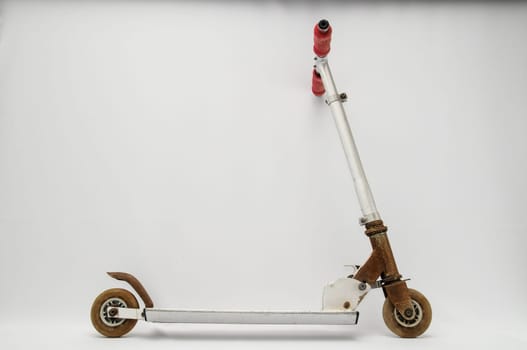 Metal scooter for child on white background