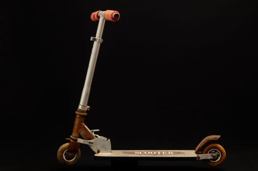 Metal scooter for child on white background