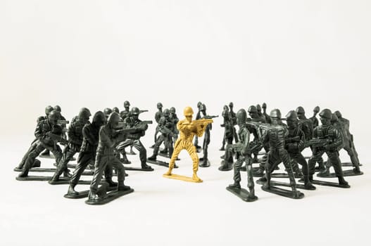 Plastic Lead Soldiers Representing War on a White Background