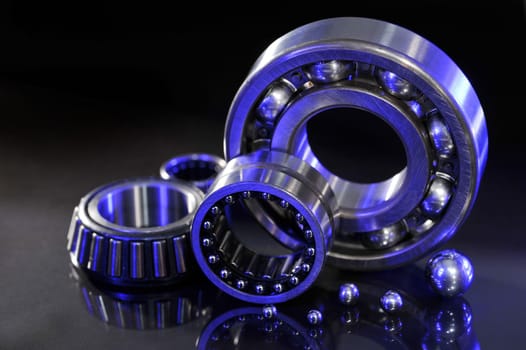 Close-up of various ball bearings in UV light