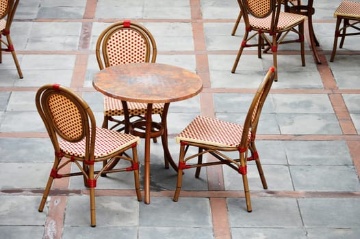 Tables and chairs in a street cafe