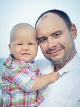 Baby and father outdoor portrait