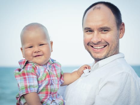 Baby and father outdoor portrait